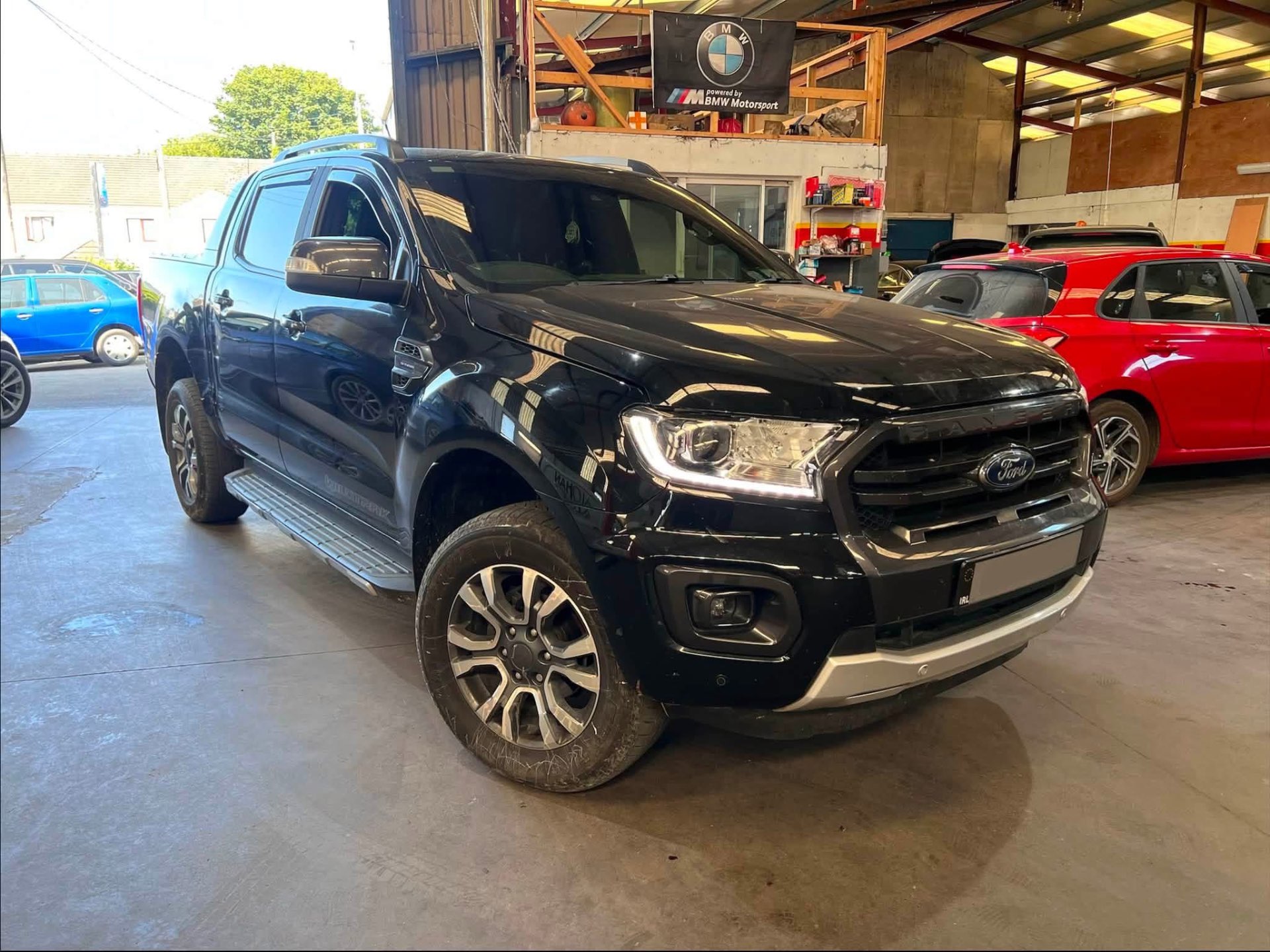 Black Ford Ranger Wildtrak inside the workshop